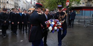 President François Hollande placed flowers and unveiled plaques at each of the sites of the attacks. Photo by Philippe Wojazer 